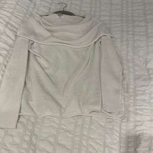 Planet sweater with triangle cut sides on bottom. Can be worn on/ off shoulder.